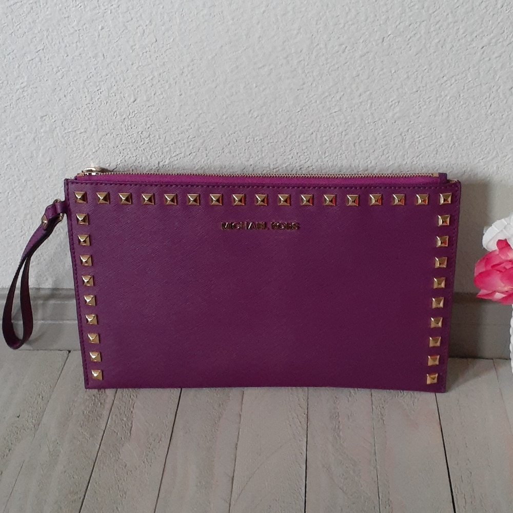 Aurhentic Michael Kors large wristlet with studded